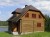 Dom uszczelniony kitem LOG HOME
 w kolorze białym
